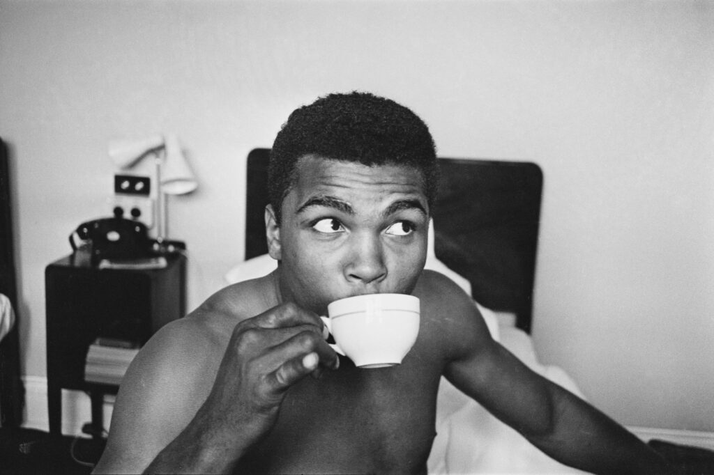 American Heavyweight boxer, Cassius Clay (later Muhammad Ali, 1942 - 2016), relaxing his hotel room, London, 27th May 1963. Clay is in London for a match against Henry Cooper on 18th June. (Photo by Len Trievnor /Daily Express/Hulton Archive/Getty Images)